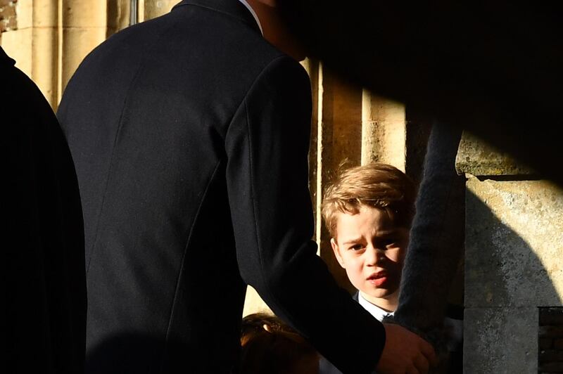 Britain's Prince George of Cambridge arrives for the Royal Family's traditional Christmas Day service at St Mary Magdalene Church. AFP