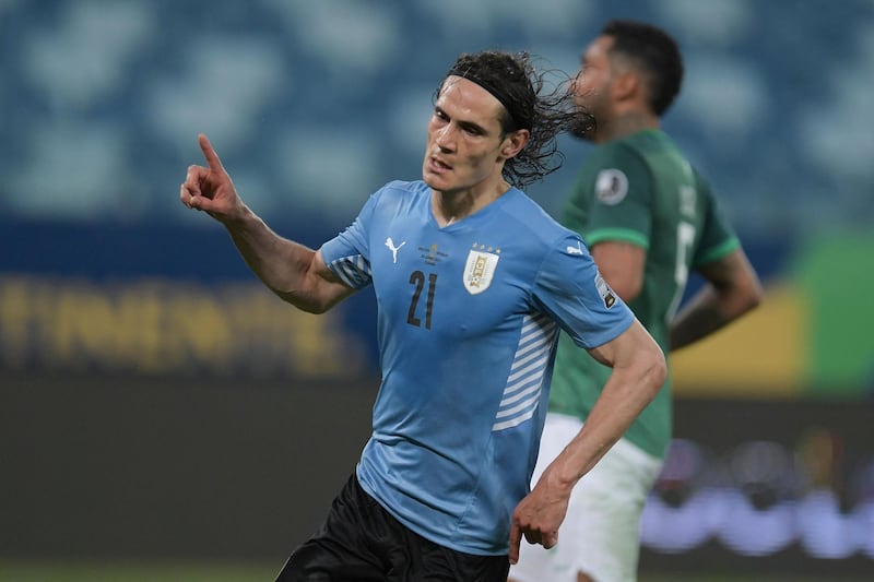 Uruguay's Edinson Cavani celebrates after scoring against Bolivia during their Conmebol Copa America 2021 football tournament group phase match at the Arena Pantanal Stadium in Cuiaba, Brazil, on June 24, 2021. / AFP / DOUGLAS MAGNO
