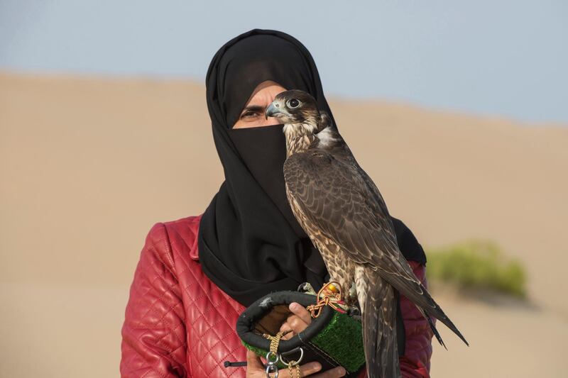 Emirati Ayesha Al Mansoori , pioneer in falconry and head trainer in Abu Dhabi Falcon Club.

Ayesha says modern gadgets like binoculars is not neccessary for Emiratis to trace the birds during hunting session , our DNA is all about desert and falcons from generation to generation.Vidhyaa for The National

