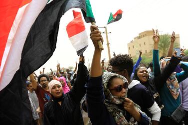 Sudanese shout slogans during a demonstration against the military council, in Khartoum, Sudan, on Sunday. Reuters