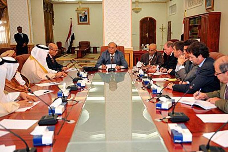 Yemen’s vice president, Abdrabu Mansur Hadi, centre, who is the acting leader, meets with Arab and western ambassadors in Sanaa yesterday. The outgoing president, Ali Abdullah Saleh, apologised for “any shortcoming” in his 33-year rule before leaving Yemen for the US on Sunday.