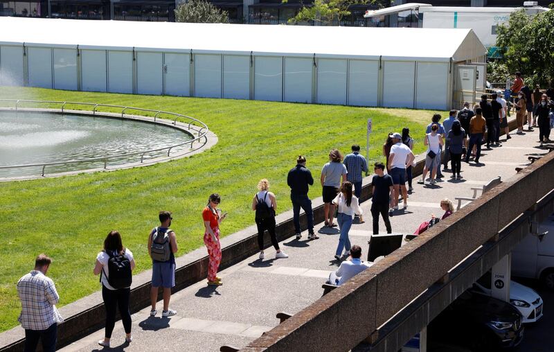 People queue outside a coronavirus disease vaccination centre at St Thomas' Hospital in London. Reuters