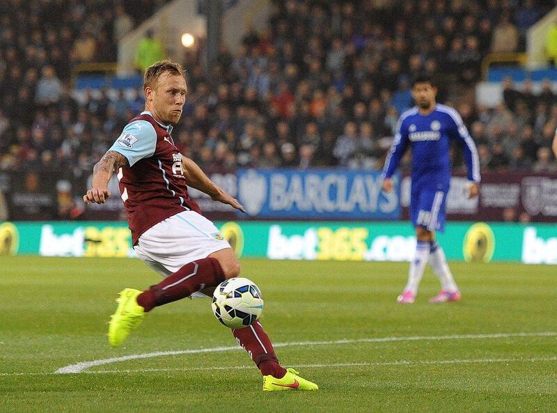 Burnley's Scott Arfield scores the opening goal against Chelsea to make it 1-0 on Monday night in their Premier League match. Peter Powell / EPA  