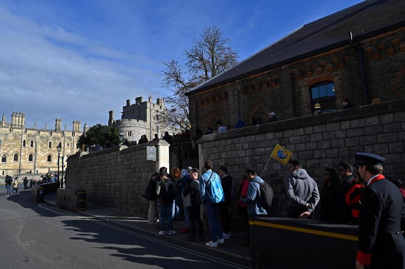 The queues do not quite match those that snaked through London to see the queen's coffin lying in state, but dozens of tourists and royal fans were in line for reopening day. AFP