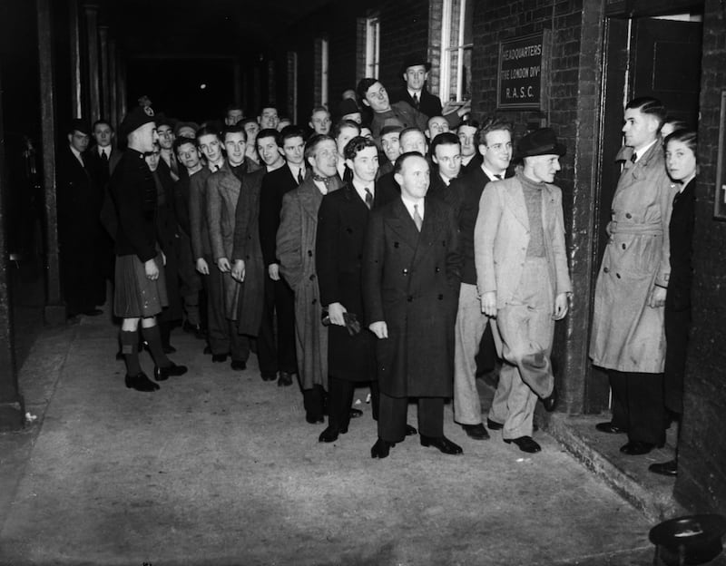 Men queuing outside the headquarters of the Royal Army Service Corps to join up on the eve of conscription in 1939 at the start of World War II. All photos: Getty Images