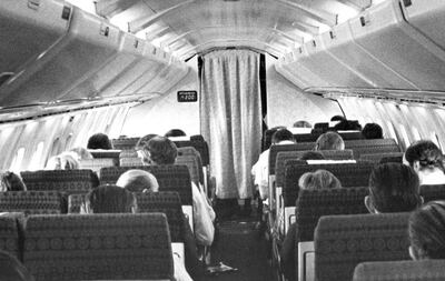 Passengers aboard a Concorde supersonic jetliner flight await lunch as the delta-winged aircraft cruises over the Atlantic Ocean at twice the speed of sound, May 1978. The digital display on the left bulkhead at the front of the cabin shows that the plane has reached Mach 2. (AP Photo)