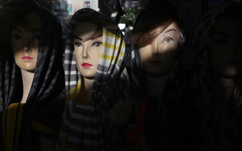 Mannequin heads dressed with head scarves at a shop in a commercial district in downtown Tehran. AP