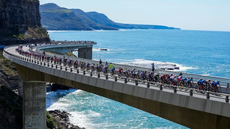 Riders cross the Sea Cliff Bridge during the elite men's road race at the world road cycling championships in Wollongong, Australia, Sunday, Sept.  25, 2022.  (AP Photo / Rick Rycroft)