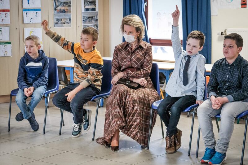 Queen Mathilde of Belgium, centre, visits a school in Namur, Belgium, as part of the week against school bullying, on February 22. The school has adopted the KiVa method, which trains teachers and primary school students in conflict management and bullying prevention. AFP