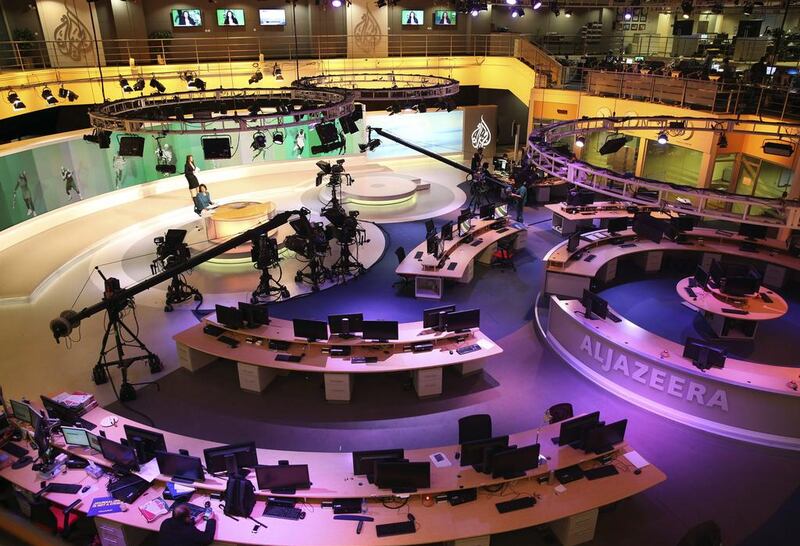One of the demands issued to Qatar is to close Al Jazeera and its affiliate stations.. Osama Faisal / AP File 