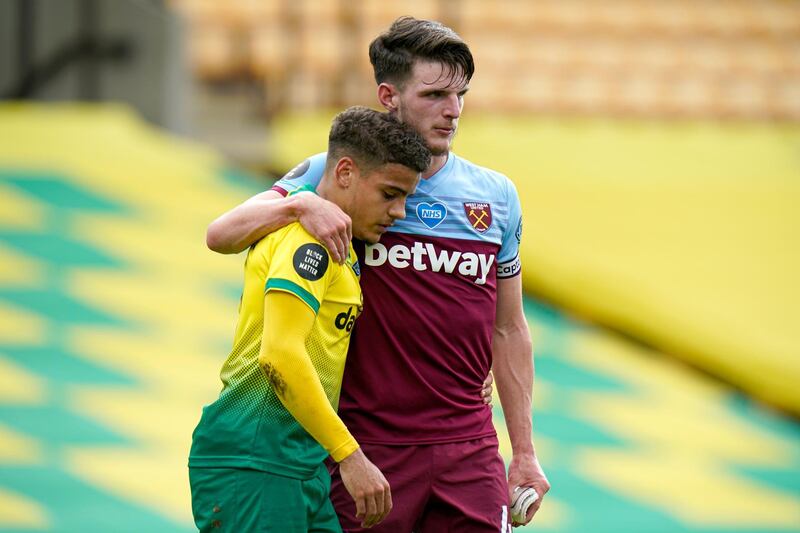West Ham's Declan Rice comforts Max Aarons of Norwich. AP