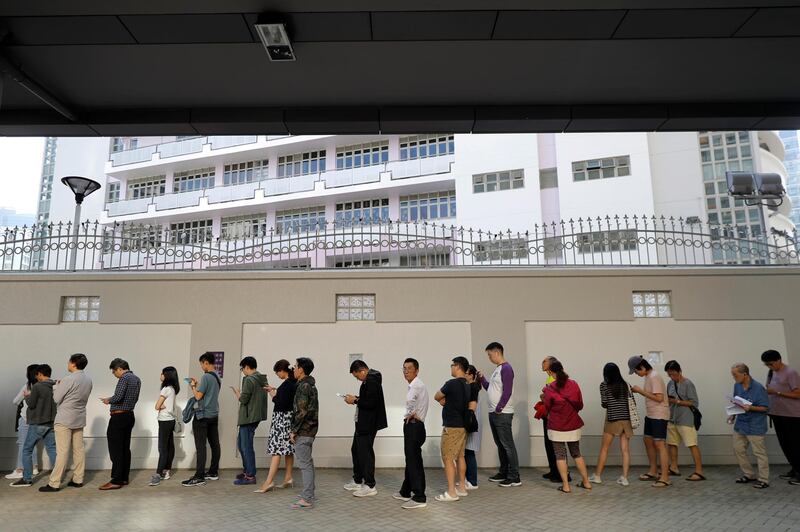 Long lines formed outside Hong Kong polling stations. AP Photo
