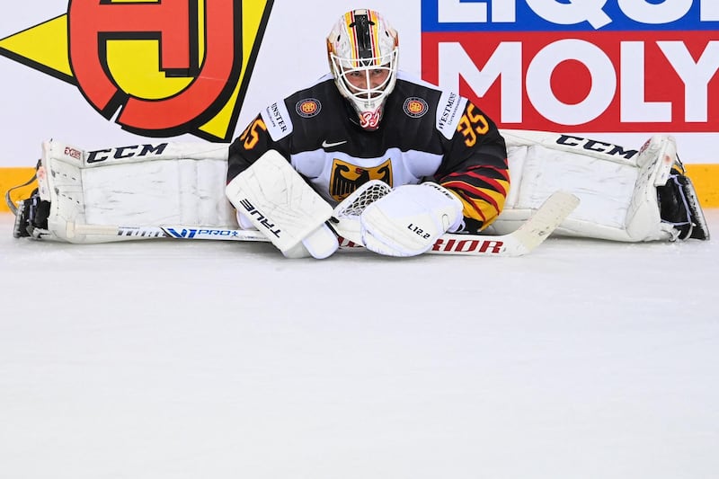 Germany netminder Mathias Niederberger stretches ahead of a shootout in the IIHF ice hockey World Championships quarter-final against Switzerland, at the Olympic Sports Center in Riga, Latvia, on Thursday, June 3. Germany won the shootout. AFP
