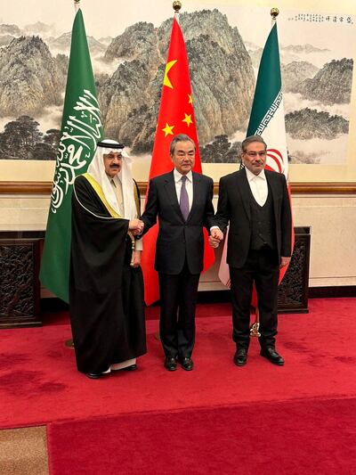 Saudi Arabia's National Security Adviser Musaad Al Aiban, his Iranian counterpart Ali Shamkhani and then Chinese foreign minister Wang Yi at the announcement of a deal to mend ties between Riyadh and Tehran. Reuters