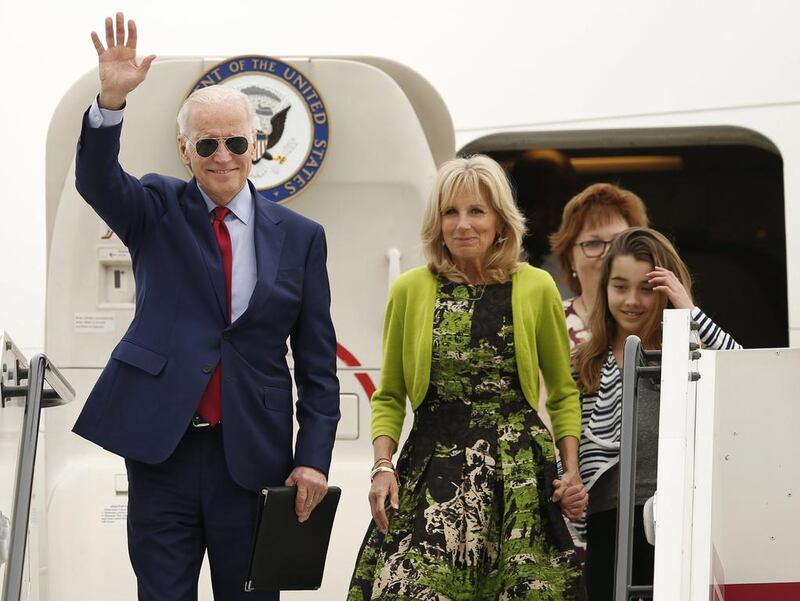 Mr Biden arrives with his wife Jill Biden in the UAE. Ali Haider / EPA