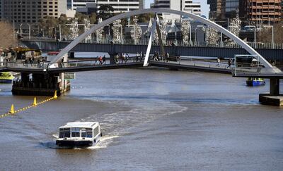 A ferry transports tourist down Melbourne's Yarra River on August 14, 2018. - Austria's capital Vienna has beaten Melbourne to be ranked the "world's most liveable city" in a new annual survey released on August 14, ending the southern Australian city's seven-year reign (Photo by William WEST / AFP)