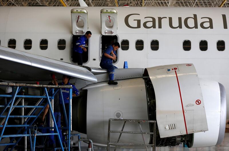 Technicians service a Garuda Indonesia Boeing 737-800 plane in Garuda Maintenance Facility (GMF) Aero Asia hangar, at Soekarno-Hatta airport near Jakarta, Indonesia. Darren Whiteside / Reuters