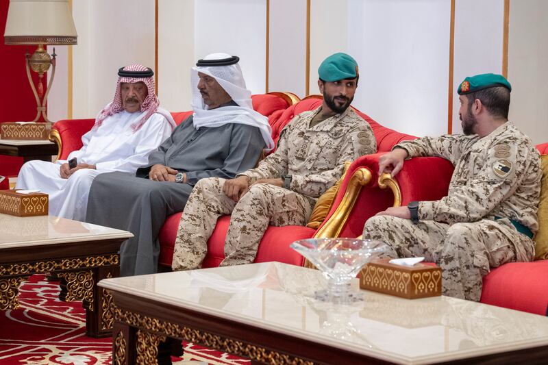 Maj Gen Sheikh Nasser and Sheikh Khalid bin Hamad attend a meeting with Sheikh Mohamed at Sakhir Airbase. Hamad Al Kaabi / UAE Presidential Court 
