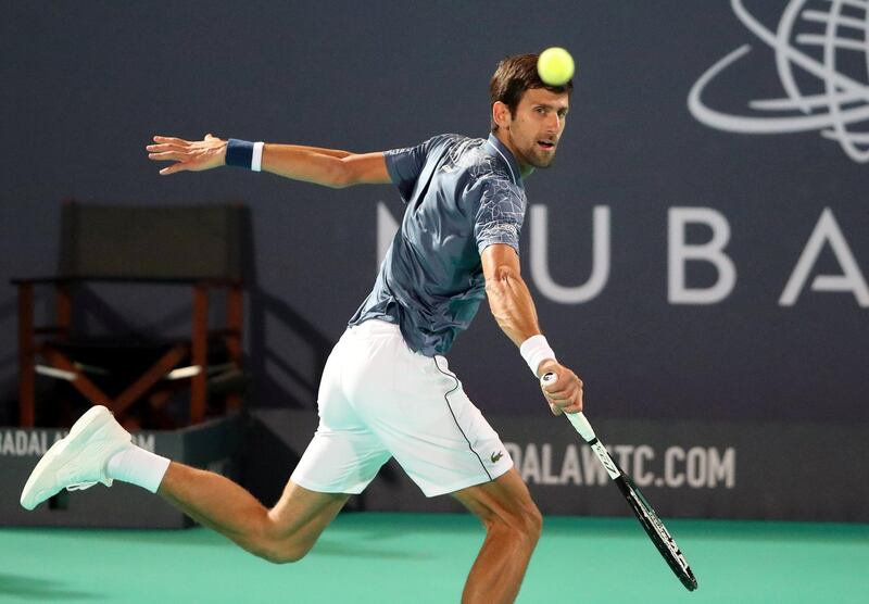 Novak Djokovic returns a shot against Karen Khachanov during their Mubadala World Tennis Championship match at Zayed Sports City. Reuters