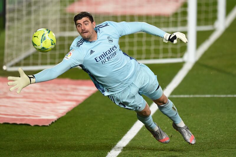 MADRID, SPAIN - DECEMBER 15: Thibaut Courtois of Real Madrid keeps the ball in play during the La Liga Santander match between Real Madrid and Athletic Club at Estadio Alfredo Di Stefano on December 15, 2020 in Madrid, Spain. Sporting stadiums around Spain remain under strict restrictions due to the Coronavirus Pandemic as Government social distancing laws prohibit fans inside venues resulting in games being played behind closed doors.  (Photo by Denis Doyle/Getty Images)