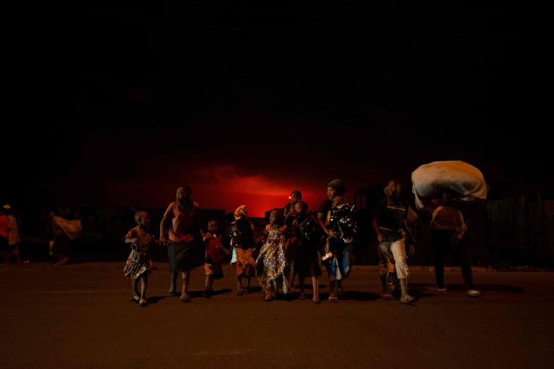 Goma residents evacuate the city following the eruption of Mount Nyiragongo. Its previous eruption, in 2002, killed 250 people and left 120,000 homeless. AFP