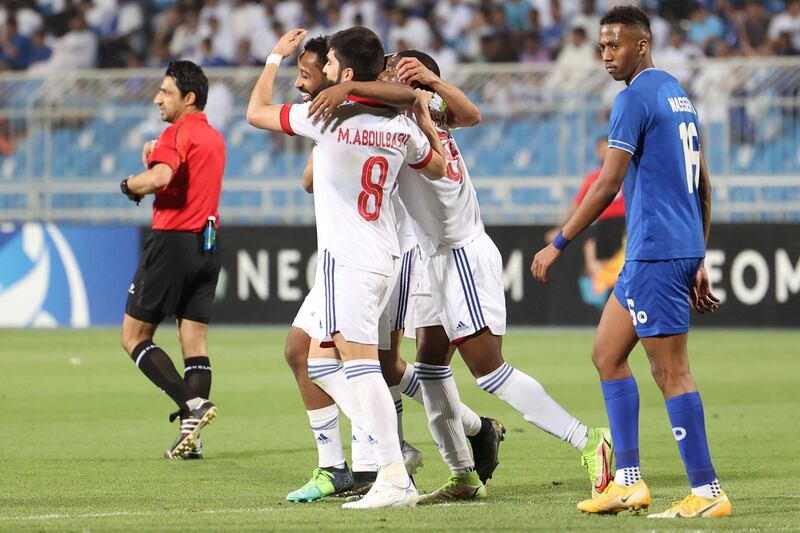 Sharjah's players celebrate scoring their second goal against Hilal.