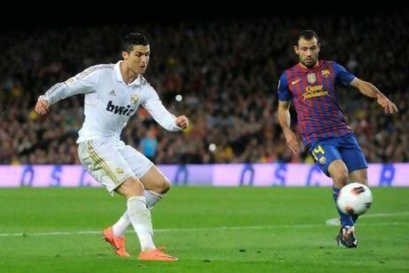 Cristiano Ronaldo, left, scored the winner to lift Real Madrid over their Primera Liga rivals, Barcelona.