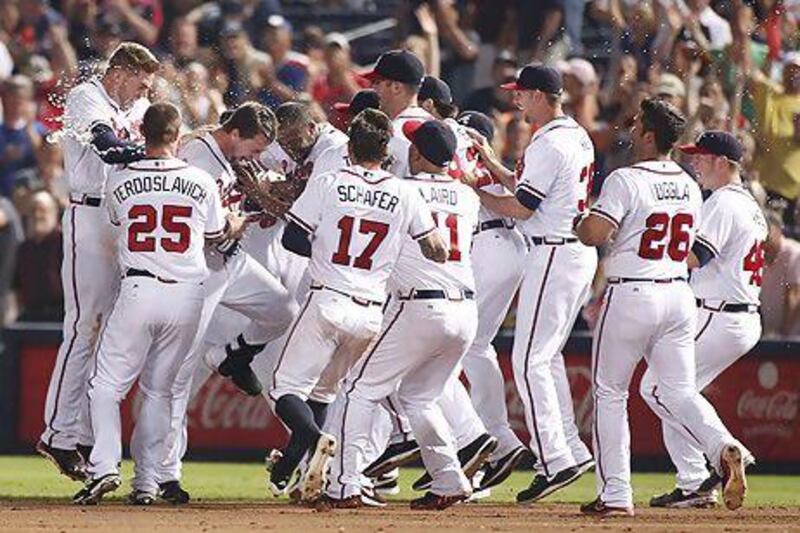 Atlanta Braves are the best team in the MLB but baseball fans in the UAE will be hard pressed to see them on TV when the play-offs start because ESPN went off the air. Tami Chappell / Reuters