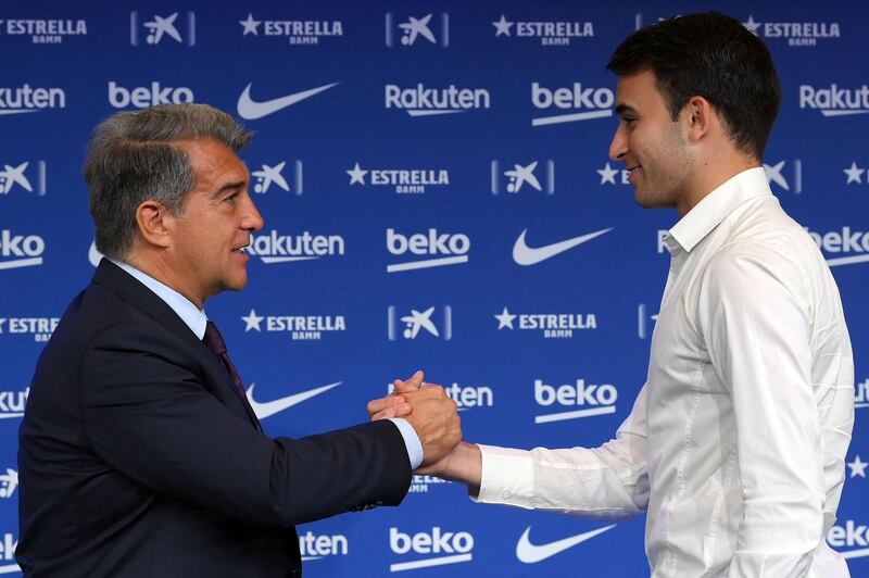 Former Manchester City's player Eric Garcia wit Barcelona president Joan Laporta during his official presentation as new Barca player at Camp Nou. AFP