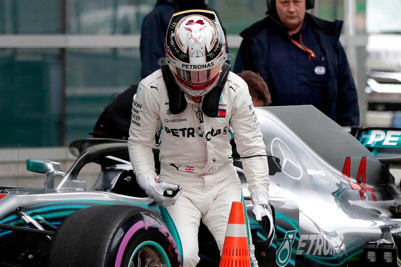 Mercedes driver Lewis Hamilton of Britain walks away from his car after finishing fourth in the qualifying session for the Chinese Formula One Grand Prix at the Shanghai International Circuit in Shanghai, Saturday, April 14, 2018. (AP Photo/Andy Wong)