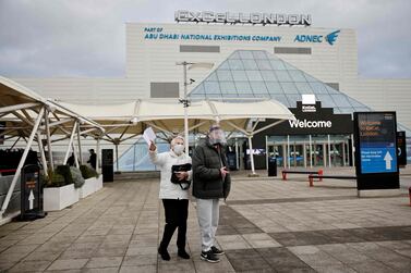 People queue for vaccinations at the Abu Dhabi-owned Excel Centre in London. AFP