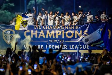 Leeds United players, on a bus in front of fans outside Elland Road, celebrate the club winning the Championship and their promotion to the Premier League. PA