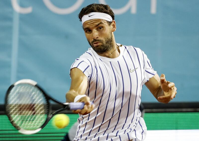 Grigor Dimitrov of Bulgaria returns to Nikola Milojevic of Serbia. Getty