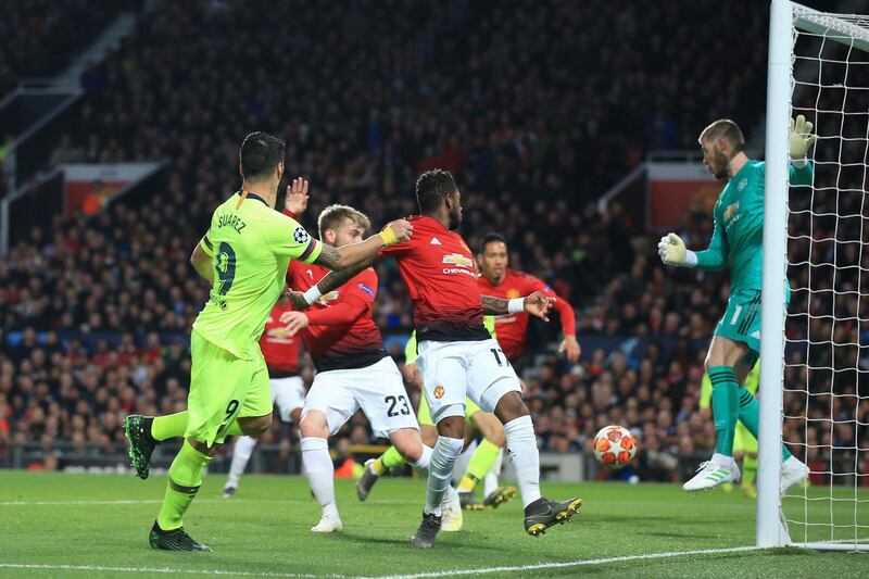 Barcelona's Luis Suarez, left, heads towards goal to create the only goal of the game. AP Photo