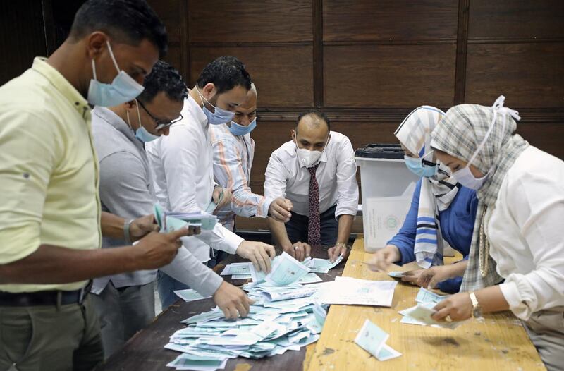 epa08808614 Election officials count ballots following the second round of parliamentary elections in Cairo, Egypt, 08 November 2020. Egyptians were called to cast their ballots in the second round of parliamentary elections on 07 and 08 November 2020 to elect the House of Representatives.  EPA/KHALED ELFIQI
