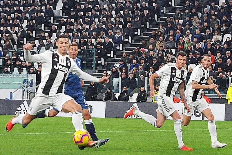 Cristiano Ronaldo shoots to score Juventus' first goal. EPA