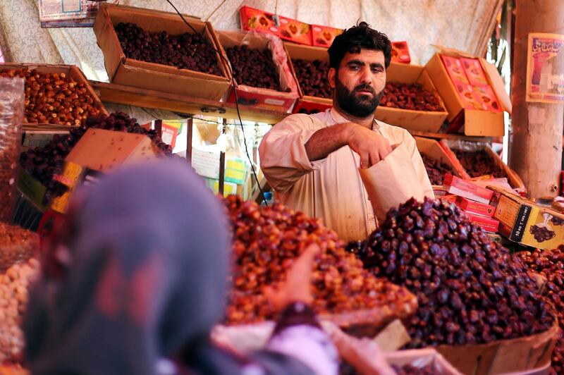 A vendor sells dates in Karachi, Pakistan.  EPA
