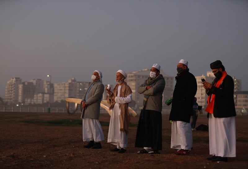 Senior Muslim clerics observes the skies over Cape Town, South Africa. AP Photo