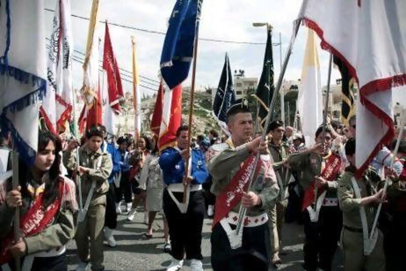 Palestinian youth scouts lead the traditional Palm Sunday procession from the Mount of Olives to Jerusalem's Old City.