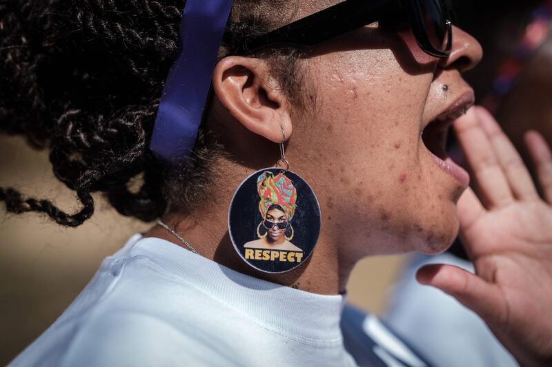 A woman shouts slogans as she participates in a feminist march, held to call a halt to the nation's femicide, in Nairobi, on International Women's Day.   AFP