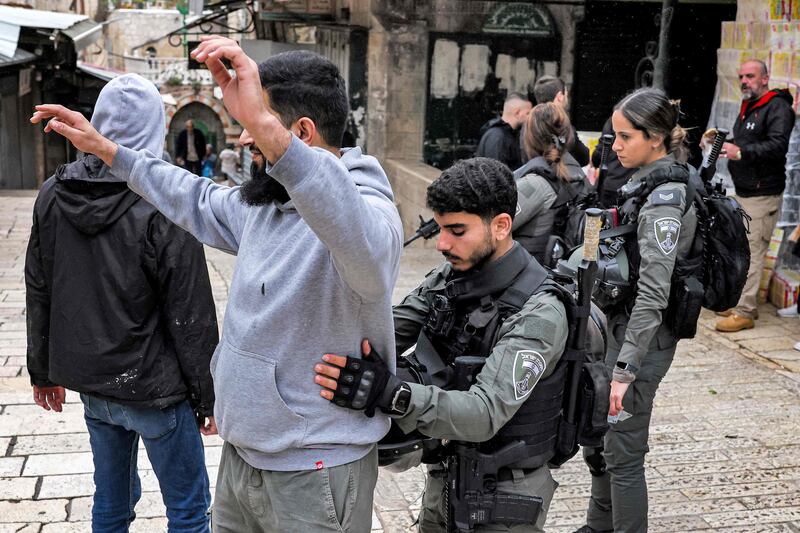 A Palestinian man is searched on Wednesday in the Old City of Jerusalem, where tensions are mounting after the killing of a senior Hamas official. AFP
