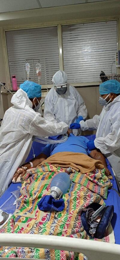 Dr Rajesh Bhagchandani, a director at Apex hospital in India's Bhopal city, (centre) intubates a patient in a facility now reserved for critically ill Covid-19 patients. He feels helpless that the hospital cannot accommodate more patients who require oxygen. Courtesy: Dr Rajesh Bhagchandani