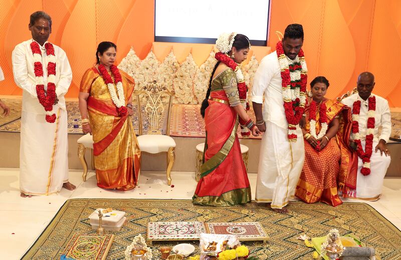The couple complete traditional ceremonies to cement their vows