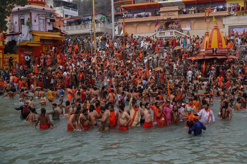 Devotees  take holy dips in the Ganges River during Kumbh Mela, or pitcher festival, one of the most sacred pilgrimages in Hinduism, in Haridwar, northern state of Uttarakhand, India. AP