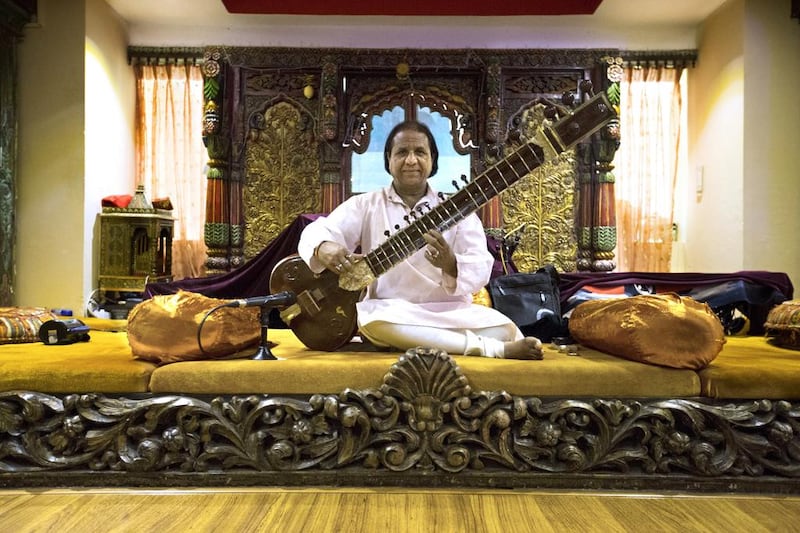 A musician plays the sitar at the Arabian Courtyard Hotel. Christopher Pike / The National