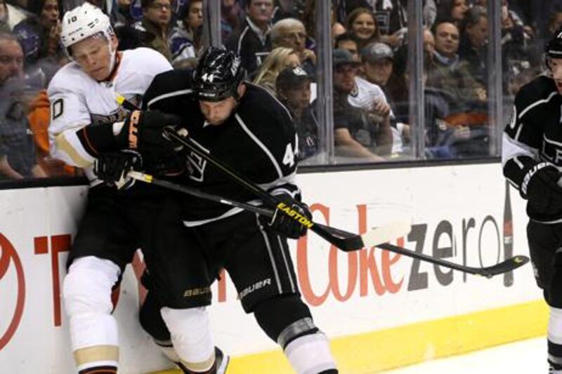 Anaheim's Corey Perry and Robyn Regehr of the Los Angeles Kings clash.