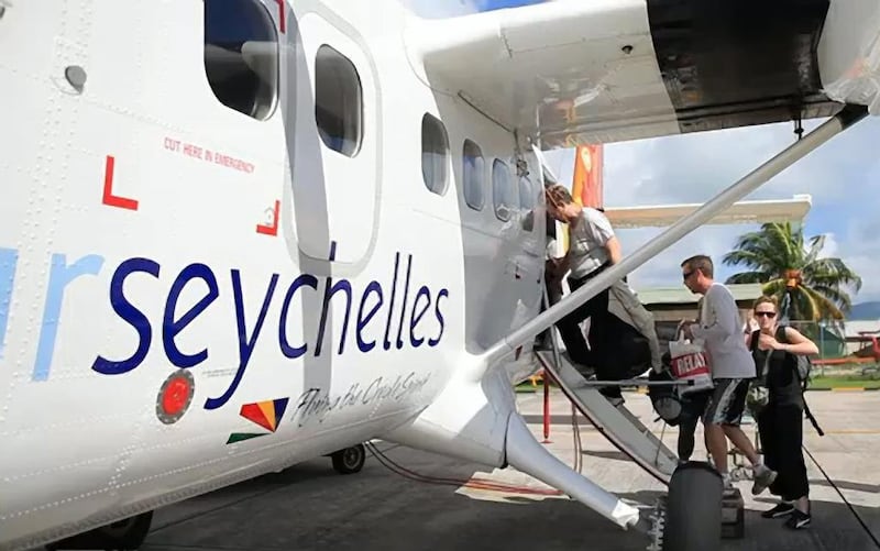 Passengers board an Air Seychelles aircraft at Seychelles International Airport on the island of Mahé. Courtesy Air Seychelles