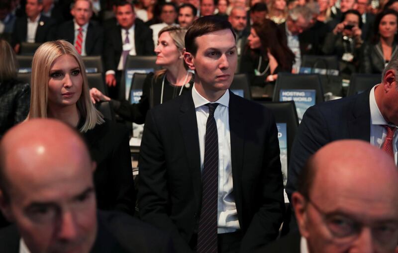 Ivanka Trump and Jared Kushner listen as US President Donald Trump delivers a speech in Davos. Reuters