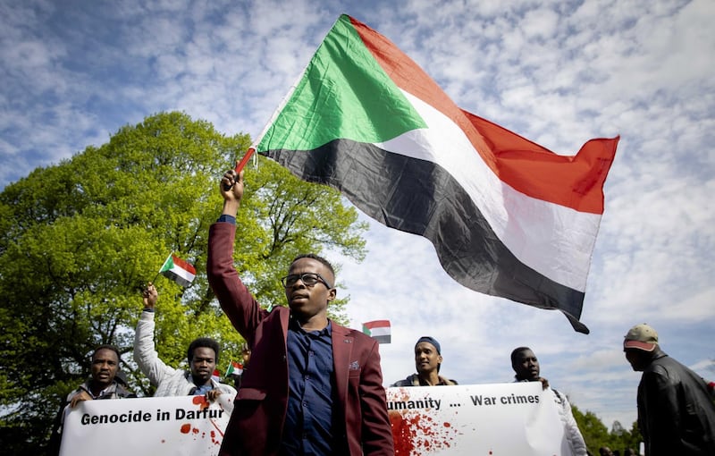 epa07529787 Sudanese refugees demonstrate at the Central Station in The Hague, The Netherlands, 26 April 2019. The protesters demanded that ousted Sudanese President Omar Al-Bashir should be trialed at the International Criminal Court (ICC).  EPA/BART MAAT