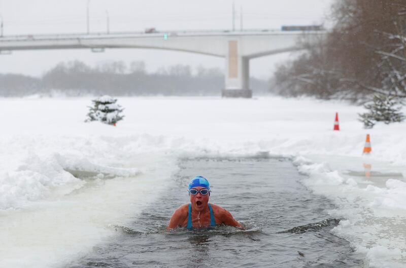 Natalya Seraya, chairwoman of "Walruses of the Capital" winter swimming club, in the icy waters of the Moskva River in Moscow on Saturday, February 13. Reuters